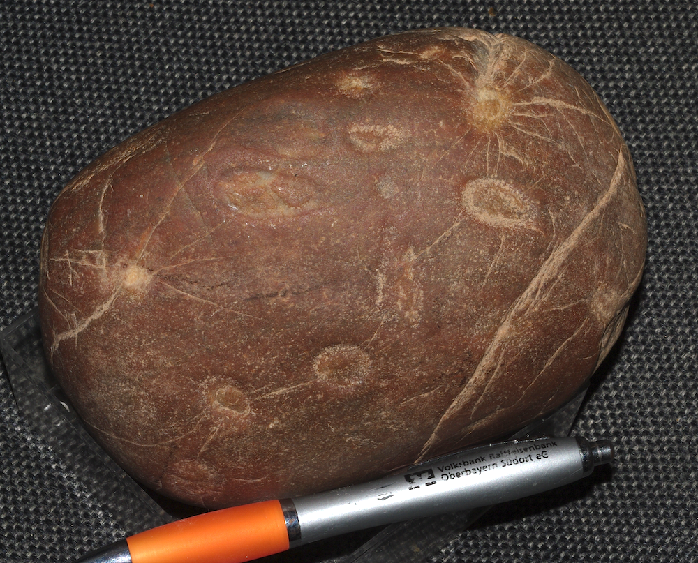 quartzite cobble, pock-marked and cratered, Azuara impact event